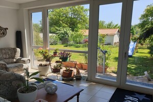 Wintergarten mit Blick in Garten 300x200px